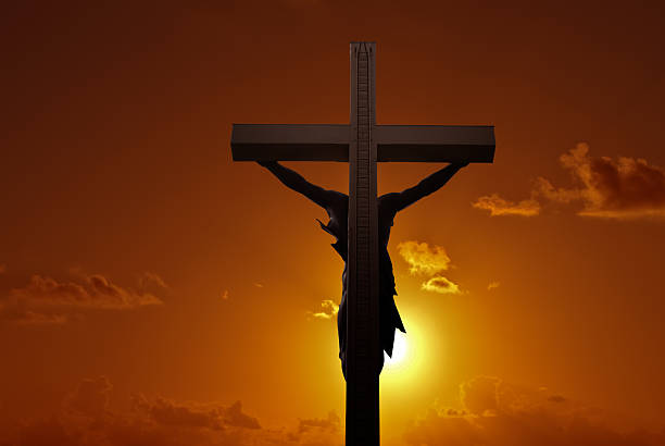 Christian cross with Jesus Christ over sunset  good friday stock pictures, royalty-free photos & images