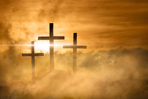 Christian Crosses Bathed in Heavenly Light  good friday stock pictures, royalty-free photos & images