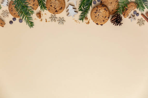 Christmas background with Chocolate chip cookies and wooden decorations stock photo