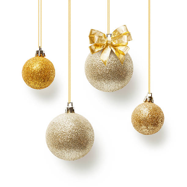 Christmas baubles Gold christmas balls decorated with bow ribbon, collection on white background gold ornaments stock pictures, royalty-free photos & images