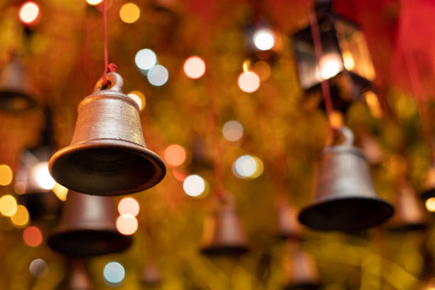 Christmas bells Hanging bells with background light and bokeh lighting used in Christmas , diwali and chinese new year. japanese lantern stock pictures, royalty-free photos & images