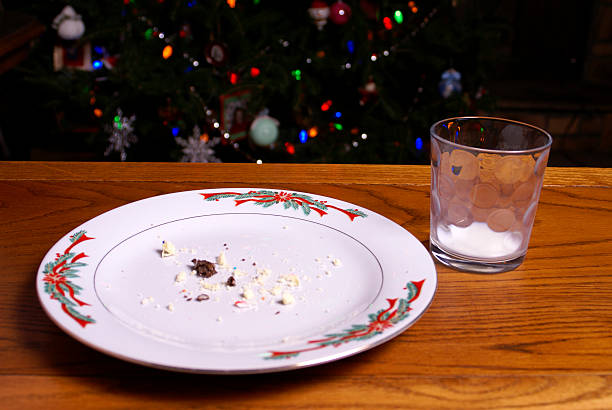 Christmas Cookie Crumbs and Empty Milk Glass stock photo