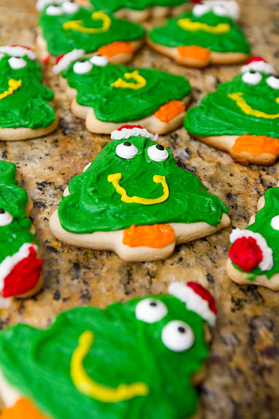 Christmas Cookies Freshly baked and frosted Christmas Tree Cookies. neicebird stock pictures, royalty-free photos & images