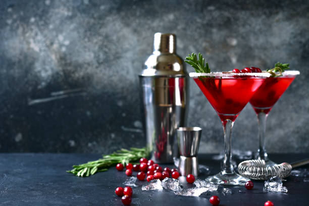 Christmas cranberry cocktail with rosemary stock photo