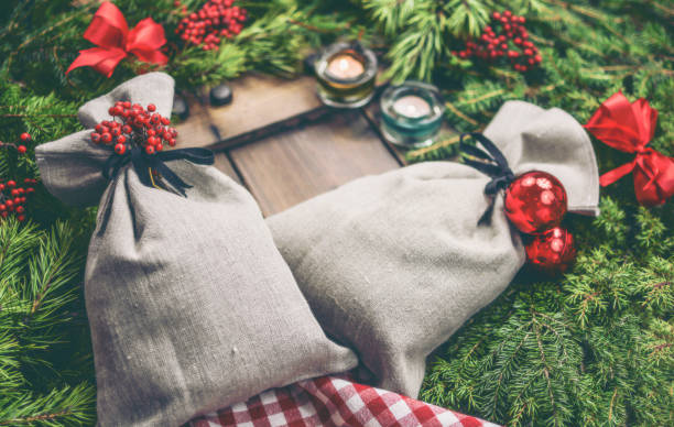 Christmas gifts in the linen bags stock photo