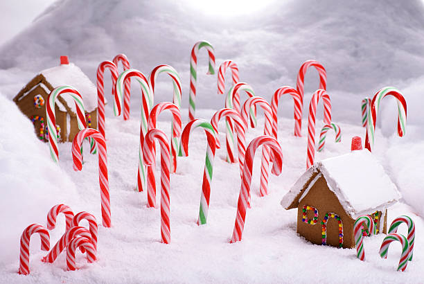 Christmas Ginger Bread Cottages in Candy Cane Forest stock photo