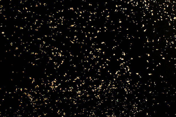 Christmas Gold glitter on black background. Holiday abstract texture stock photo