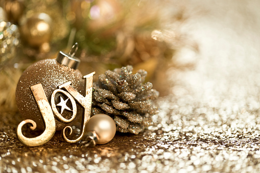 Christmas Gold Ornaments Background. Very shallow depth.