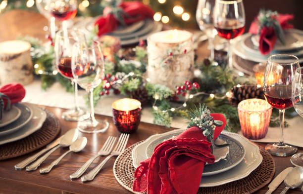 Christmas Holiday Dining Christmas holiday dining table elegant place setting. Very shallow depth dining table stock pictures, royalty-free photos & images