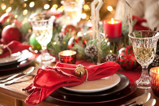 Christmas Holiday Dining Christmas holiday dining table elegant place setting. Very shallow depth centerpiece stock pictures, royalty-free photos & images