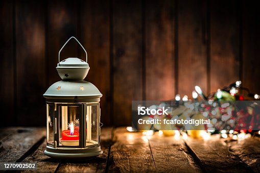istock Christmas lantern on wooden table. Copy space 1270902502