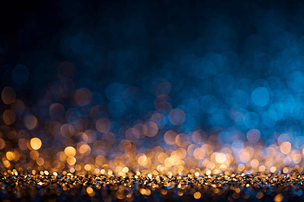 lampu natal latar belakang defocused - bokeh gold blue - hari raya acara perayaan potret stok, foto, & gambar bebas royalti