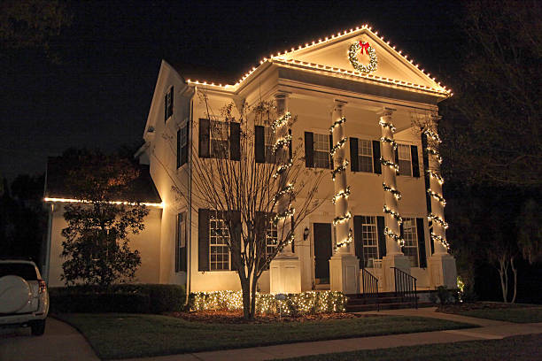 Christmas Lights A Colonial House with a lot of Christmas Lights christmas lights house stock pictures, royalty-free photos & images