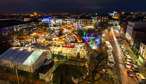 Christmas Market at night, panoramic view Christmas market in Galway at night, panoramic view from high point. galway stock pictures, royalty-free photos & images