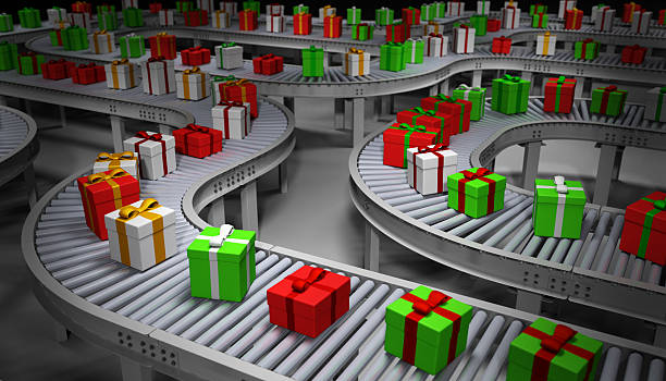 Christmas Presents on Conveyor Belts It's Santa's secret factory. Conveyor belts loaded with Christmas presents. conveyor belt photos stock pictures, royalty-free photos & images