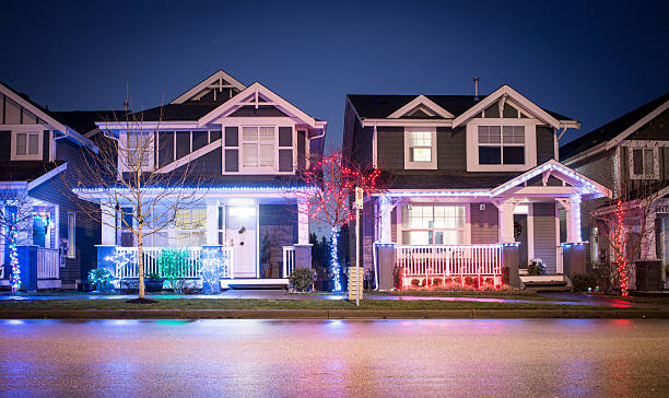Christmas Spirit Suburban houses illuminated in christmas decorations christmas lights house stock pictures, royalty-free photos & images