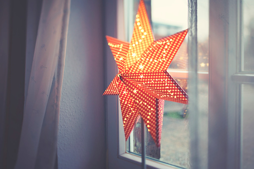 Christmas star lamp on the windowsill