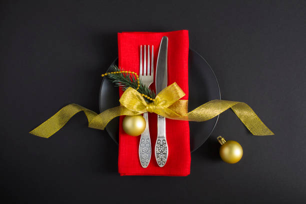 Christmas table setting on the black background. Top view. Close-up. stock photo
