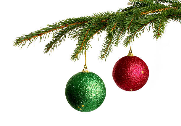 Christmas tree branches holding two decorative balls Couple of Christmas Balls. christmas tree close up stock pictures, royalty-free photos & images
