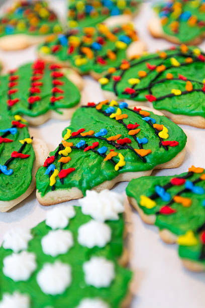 Christmas Tree Cookies Freshly baked and decorated Christmas tree cookies. neicebird stock pictures, royalty-free photos & images