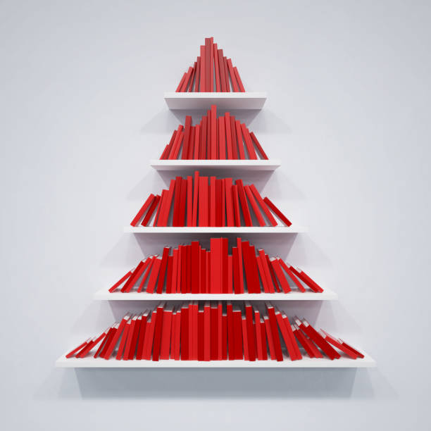 Christmas tree from books on the shelf stock photo