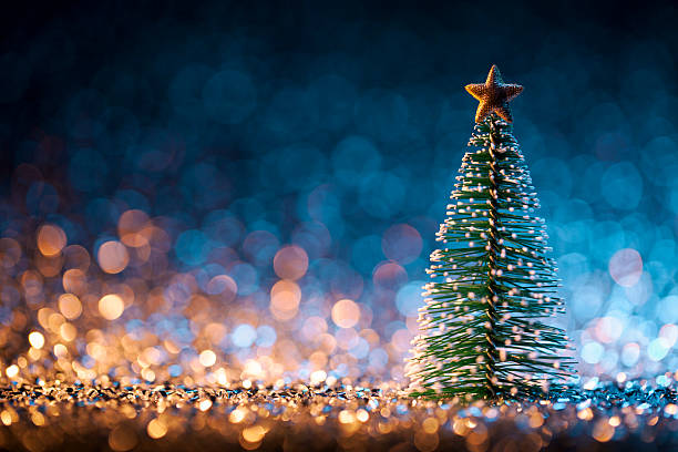 Christmas tree on defocused lights. Decorations Bokeh Blue Gold stock photo