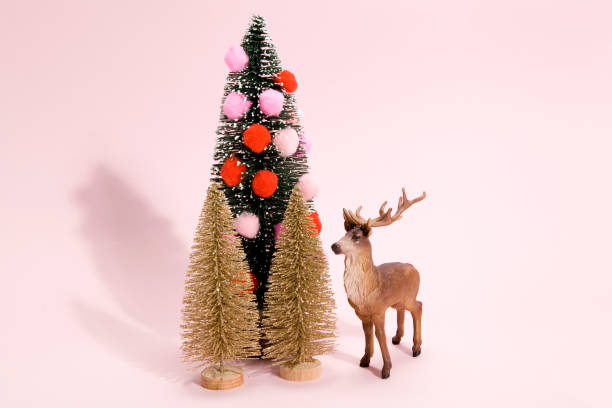 christmas trees and reindeer stock photo