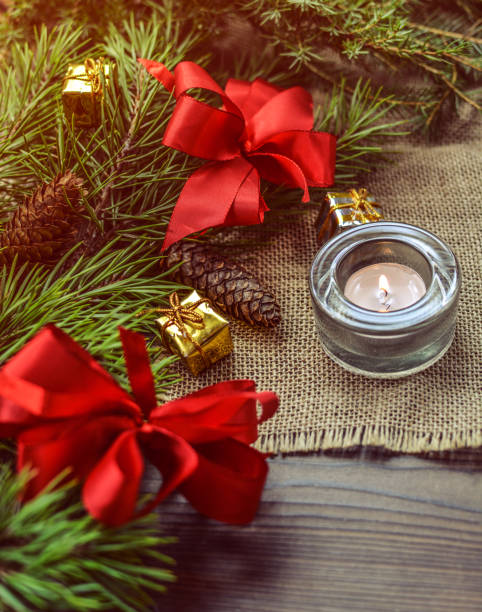 Christmas vintage decoration with candle and pine branches stock photo