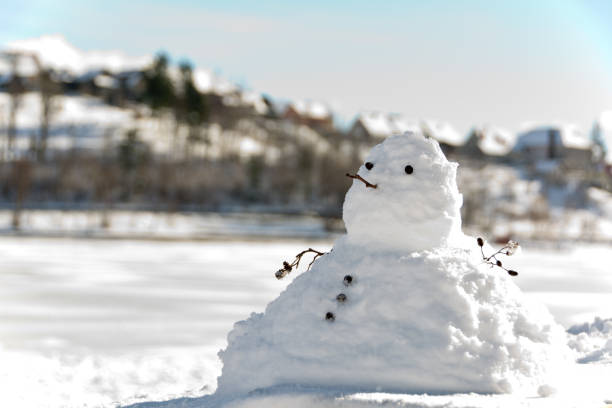 chubby snowman chubby snowman and de focused background melting snow man stock pictures, royalty-free photos & images