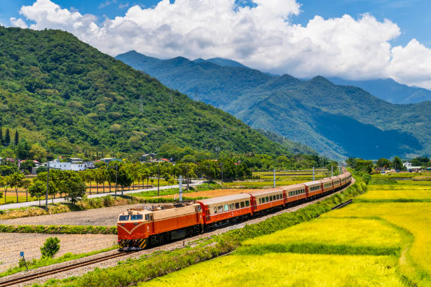 Chu-Kuang Express train traveling the beautiful countryside of Taitung, Taiwan stock photo