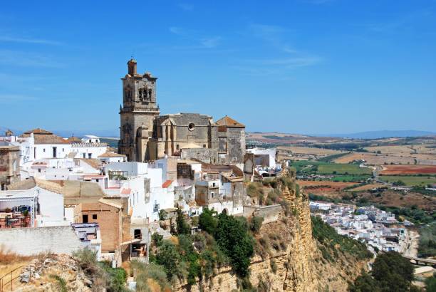 Church and white town, Arcos de la Frontera, Spain. stock photo