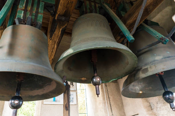 Church bells Three large church bells made of copper. bell tower tower stock pictures, royalty-free photos & images