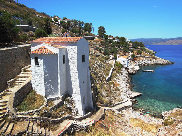 Church on rocks at Hydra Island stock photo
