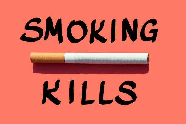 Cigarette and text  Smoking kills Cigarette and text Smoking kills on orange background Smoking Kills stock pictures, royalty-free photos & images