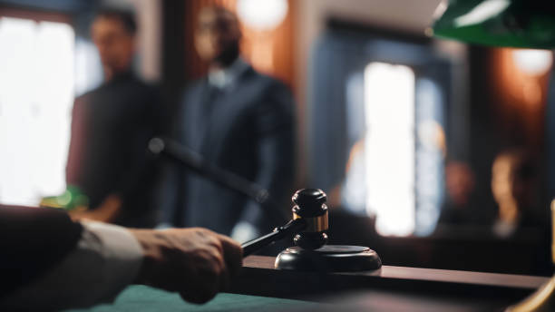 Cinematic Court of Law and Justice Trial: Judge Ruling Out a Positive Decision in a Civil Family Case, Close Up of a Striking Gavel to End Hearing. stock photo