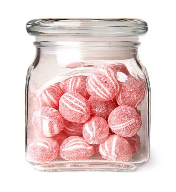 Cinnamon Balls Candy in a Glass Jar  candy jar stock pictures, royalty-free photos & images