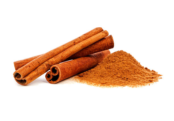 Cinnamon Cinnamon sticks and powder on white background cinnamon stock pictures, royalty-free photos & images