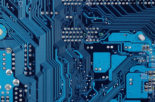 Close up of old printed blue computer circuit board