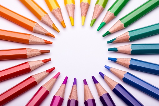 A colour wheel displays colour hues in the shape of a circle. So the relationships between primary colours, secondary colours, tertiary colours and so on can easily be seen. In this image the colour wheels is created from a group of colour pencils.