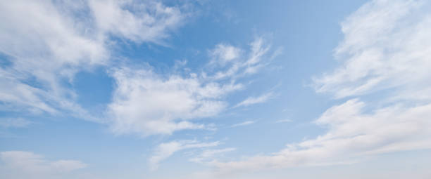 Cirrus Clouds in a Blue Sky Cirrus clouds appear in a blue sky over Tule Lake National Wildlife Refuge, California, USA. jeff goulden panoramic stock pictures, royalty-free photos & images