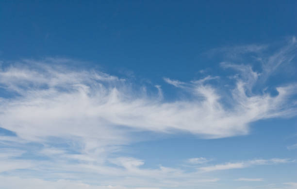 Cirrus Clouds in a Blue Sky Cirrus clouds appear in a blue sky over the Prescott National Forest near Camp Verde, Arizona, USA. jeff goulden cloud backgrounds stock pictures, royalty-free photos & images