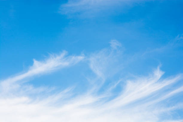 Cirrus clouds over a blue sky Cirrus clouds over a blue sky background wispy stock pictures, royalty-free photos & images