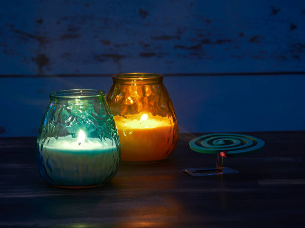 Citronella candles and mosquito spiral stock photo