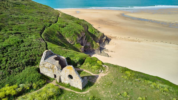 City Church, Carteret Image of Vielle Eglise, beach, sea and sand dunes.Carteret, Normandy, France barneville carteret stock pictures, royalty-free photos & images