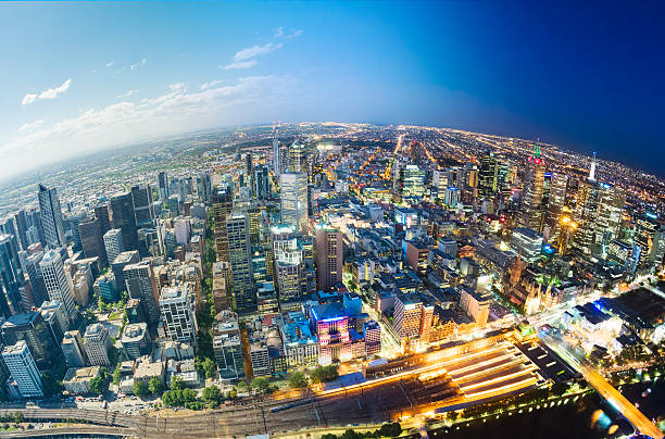 City fading from day to night Aerial view of Melbourne, fading from day to night fish eye lens stock pictures, royalty-free photos & images