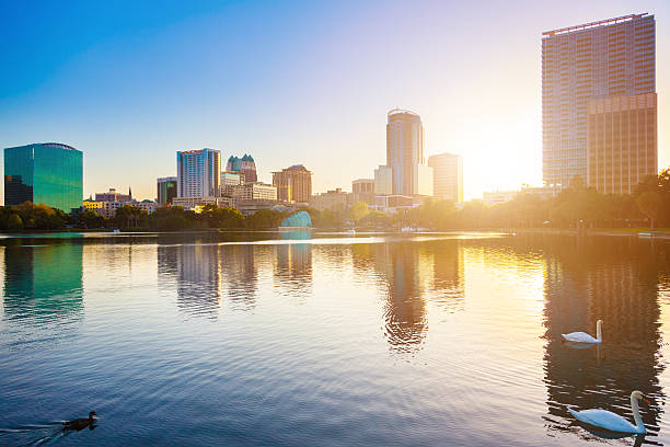 City of Orlando at Sunrise, Lake Eola, Florida, USA stock photo