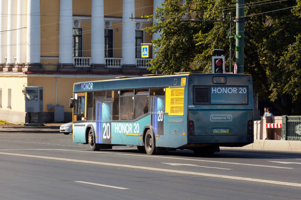 City public bus in the city center St. Petersburg, Russia - June 23, 2019: City bus rides on the palace bridge"n  towards the Hermitage and Nevsky Prospect. Empty morning road unesco organised group stock pictures, royalty-free photos & images