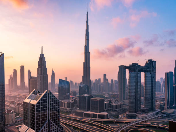 City skyline in Dubai Dubai sky line with traffic junction and Burj Khalifa. burj khalifa stock pictures, royalty-free photos & images