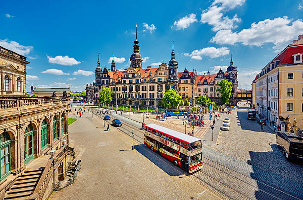 City tour Dresden Tourist bus, double-decker bus, sightseeing bus, city tour from the point of view of the Zwinger with a view of the cathedral in Dresden. dresden germany stock pictures, royalty-free photos & images