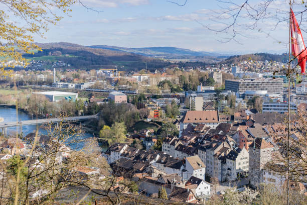 City view of Brugg Ost with Aare river, ancient town and Salzhaus. Cityscape of Brugg Ost with Mühlimatt Turnhalle, Kloster Königsfelden, residential,  commercial districts, historic old town, Salzhaus  and the casino bridge for vehicles. Picture taken from Hexenplatz. aargau canton stock pictures, royalty-free photos & images